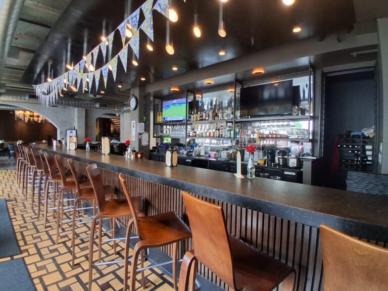 La Cucina restaurant bar with warm lighting and patterned tile floor