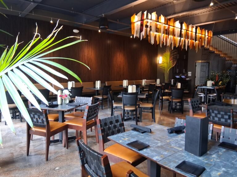 La Cucina dining area with palm accents
