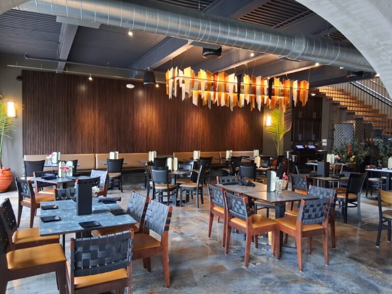 Wide view of La Cucina's dining room and mezzanine staircase